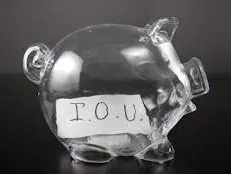 IOU note stuck on a piggy bank